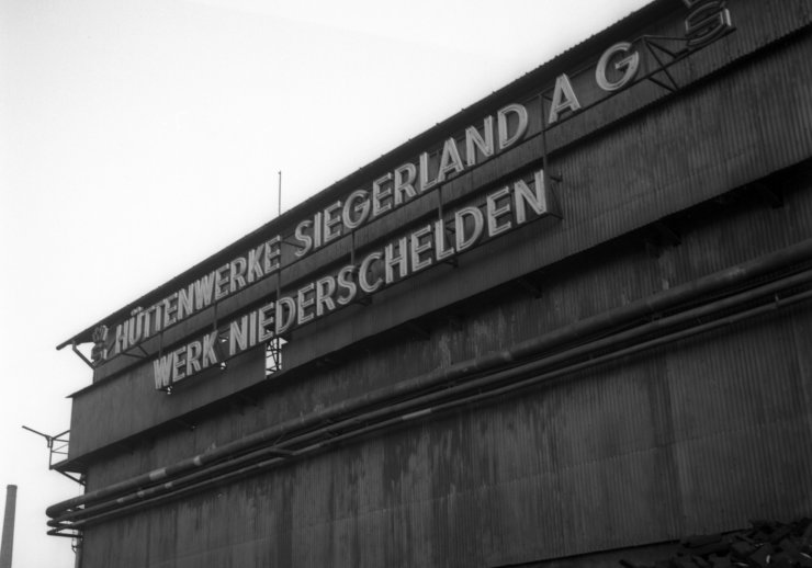 Firmenbeschriftung: Hüttenwerke Siegerland AG, Werk Niederschelden, 1963.
